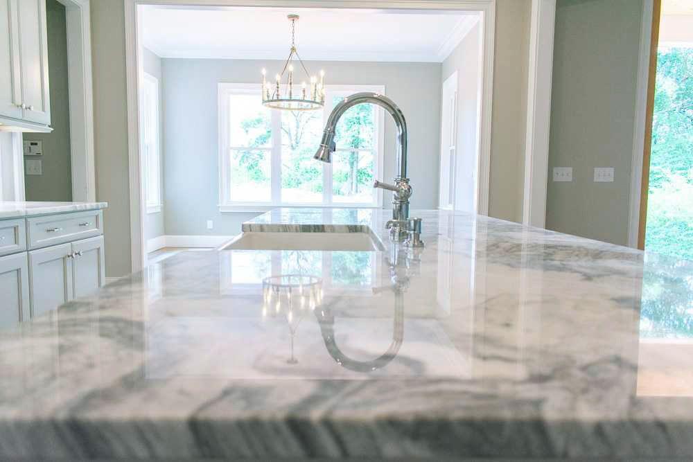 beautiful closeup of custom designed kitchen, with marble looking