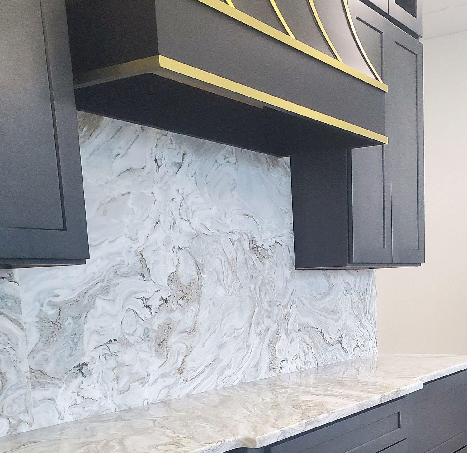 Charcoal Cabinets Vent Surround Brass Strapping with Quartzite Countertops